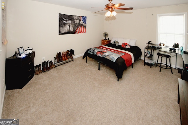 bedroom featuring light carpet and ceiling fan