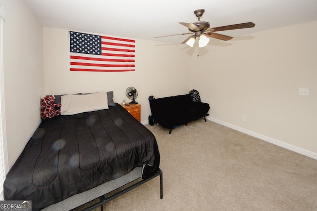 bedroom featuring light carpet and ceiling fan