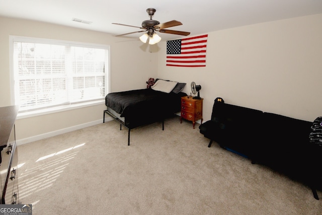 bedroom featuring ceiling fan and light colored carpet