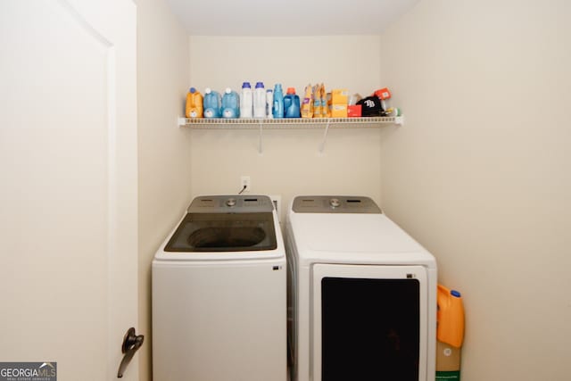 washroom with independent washer and dryer