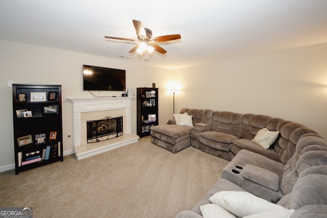 living room featuring ceiling fan and light colored carpet