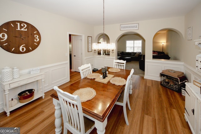 dining room featuring a notable chandelier and wood-type flooring