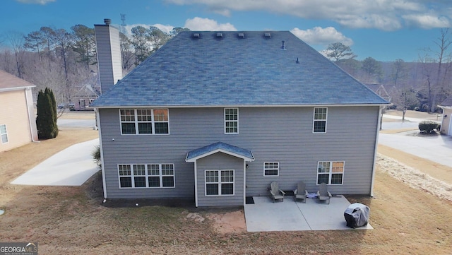 rear view of house with a patio