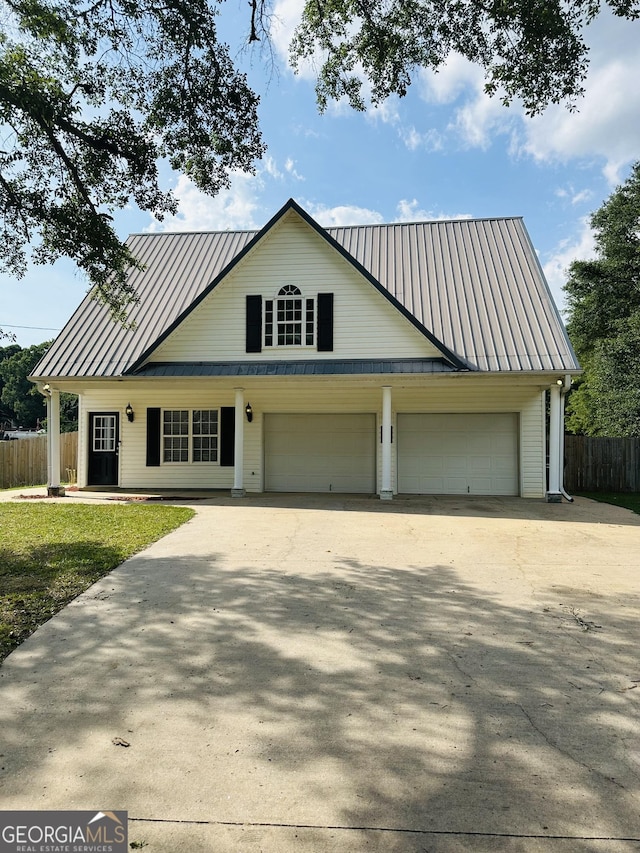 view of front of home with a front lawn and a garage