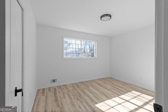 empty room with light wood-type flooring