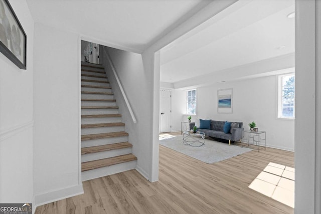 stairs featuring hardwood / wood-style flooring