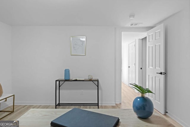 sitting room with hardwood / wood-style floors