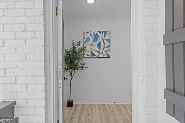 interior details featuring hardwood / wood-style flooring and ornamental molding