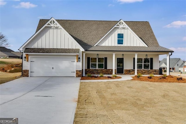 view of front of property featuring a garage and a porch