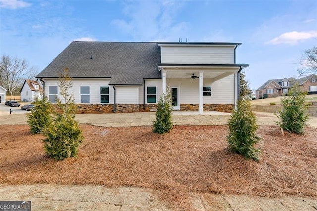 rear view of house featuring ceiling fan