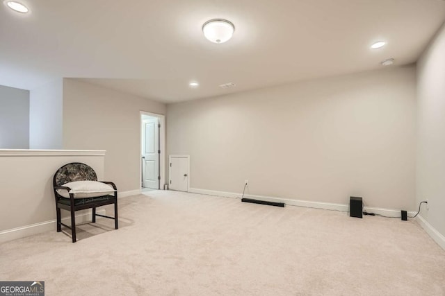 living area with light carpet