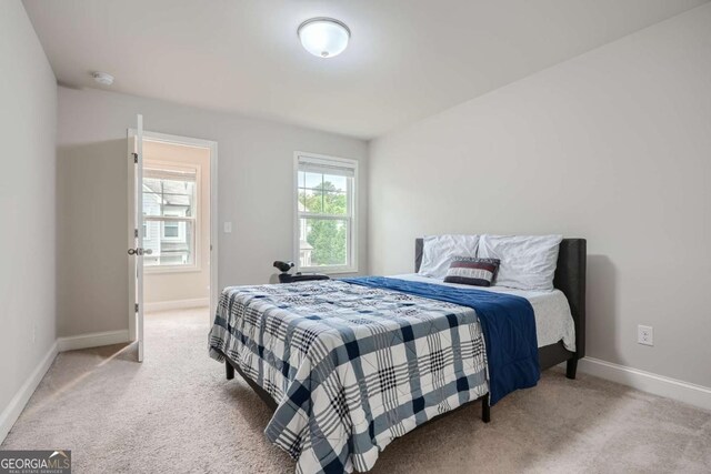 bedroom featuring carpet