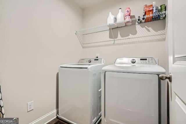 laundry area featuring washing machine and clothes dryer