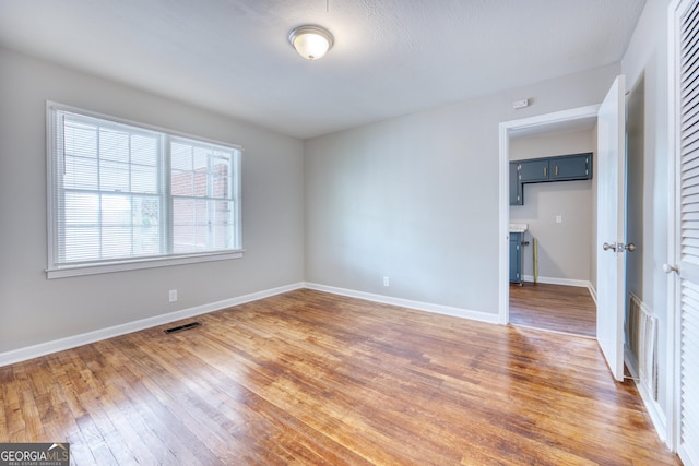 spare room featuring dark hardwood / wood-style floors