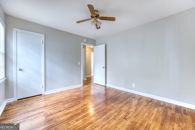 unfurnished bedroom featuring light hardwood / wood-style flooring and ceiling fan