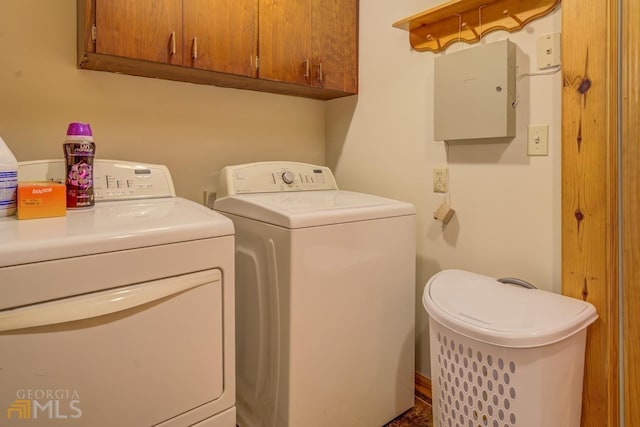 laundry room featuring cabinets and separate washer and dryer