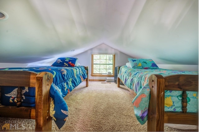 carpeted bedroom featuring lofted ceiling