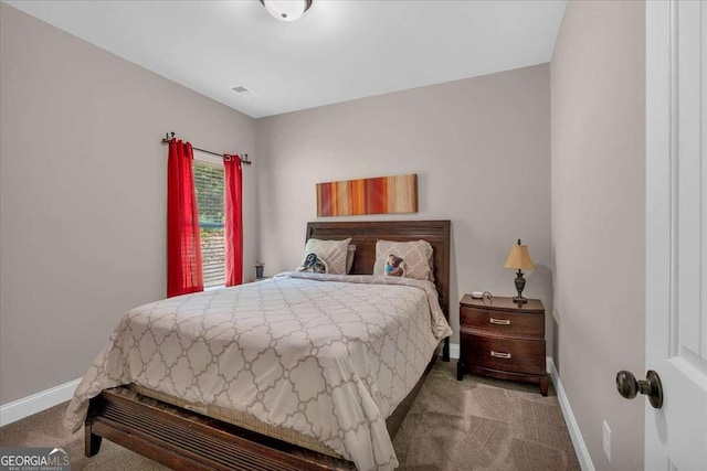 bedroom with light colored carpet