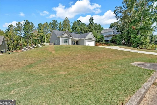 view of front facade with a garage and a front lawn