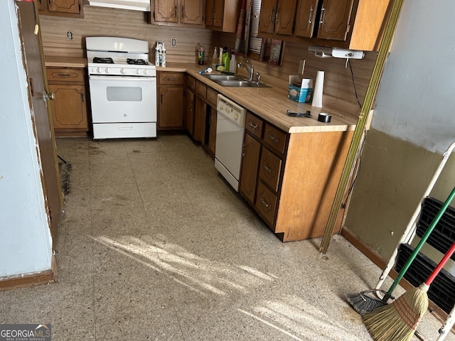 kitchen featuring backsplash, sink, white appliances, and ventilation hood