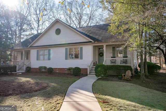 single story home with a porch and a front yard