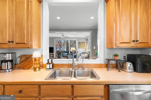 kitchen with stainless steel dishwasher, ceiling fan, ornamental molding, and sink