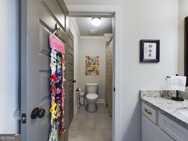 bathroom featuring vanity, toilet, and crown molding