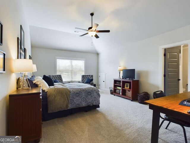 carpeted bedroom featuring vaulted ceiling and ceiling fan