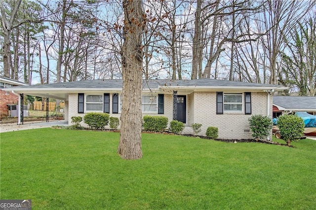 ranch-style home with a carport and a front lawn