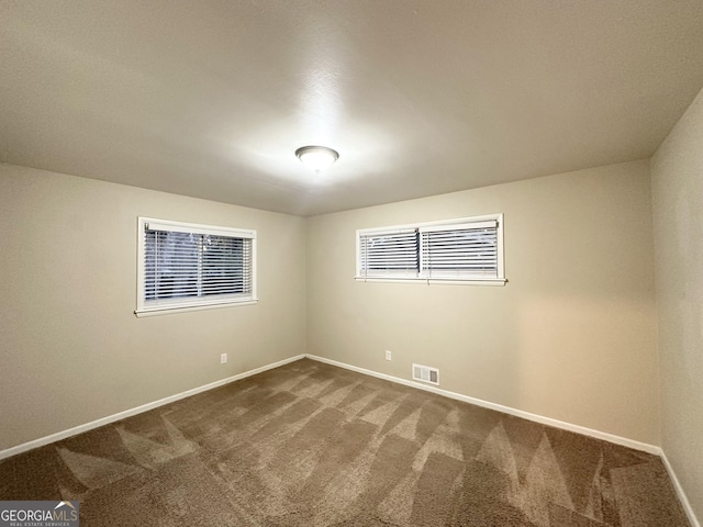 view of carpeted spare room