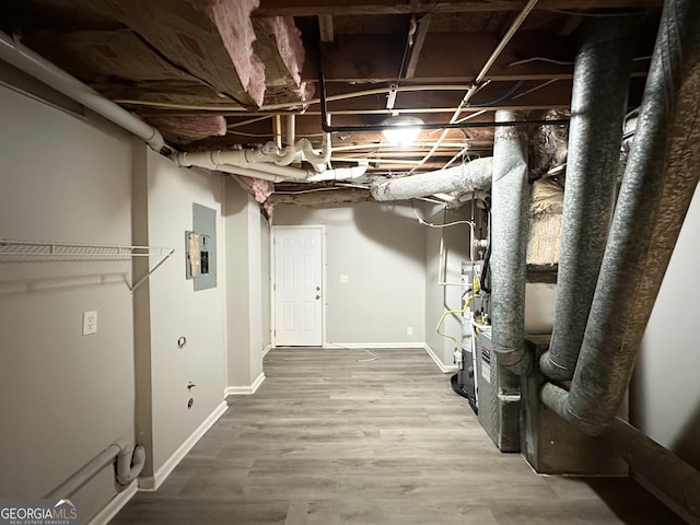 basement featuring hardwood / wood-style floors