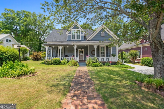 view of front of house featuring covered porch and a front yard