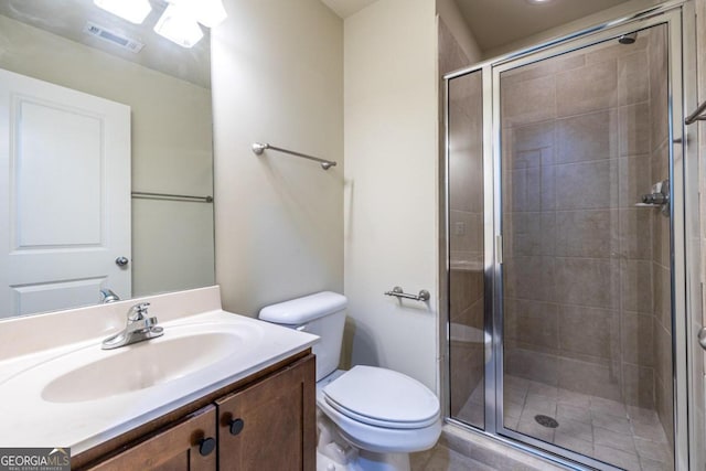 bathroom with vanity, toilet, and walk in shower