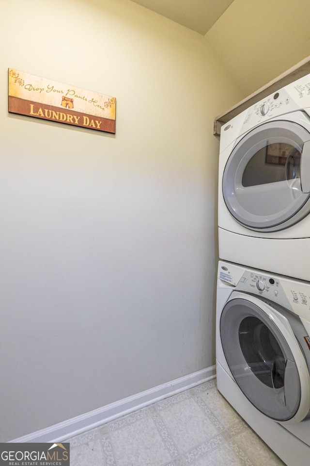 laundry area featuring stacked washer and dryer