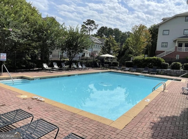 view of swimming pool featuring a patio area