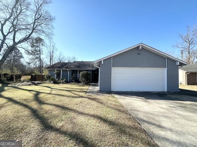 view of front of house with a garage and a front lawn