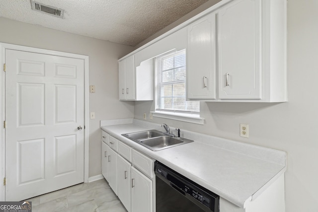 kitchen featuring black dishwasher, visible vents, light countertops, white cabinetry, and a sink