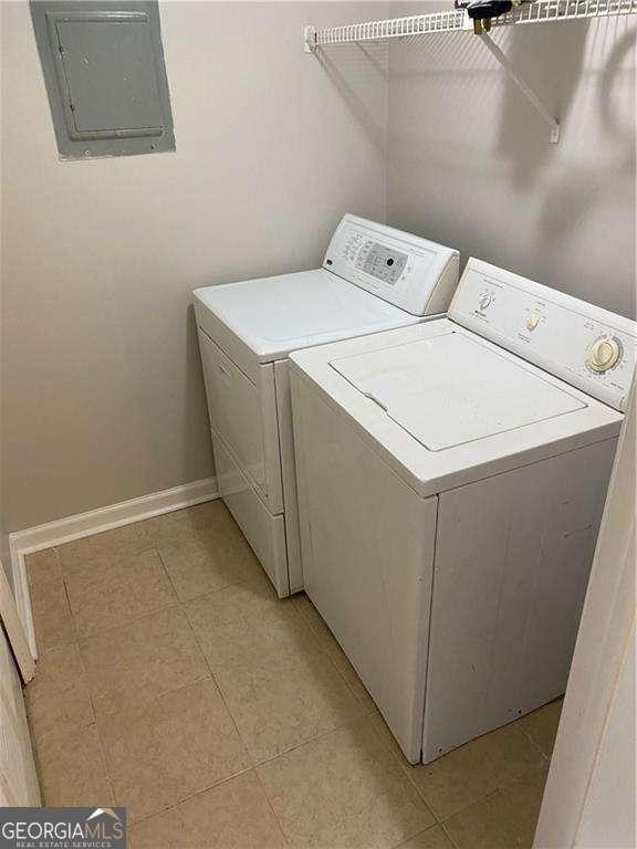 laundry area featuring electric panel and washer and dryer