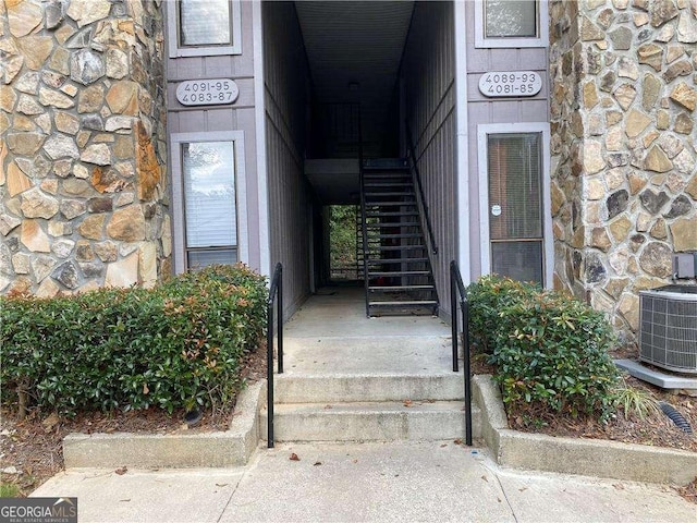 property entrance featuring central AC