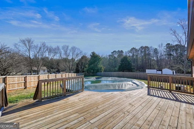 wooden deck featuring a covered pool