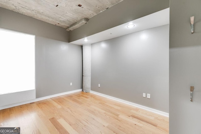 unfurnished room featuring light wood-type flooring