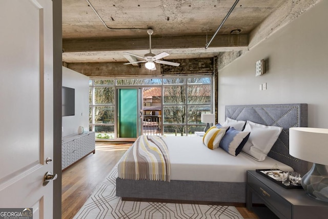 bedroom with hardwood / wood-style flooring