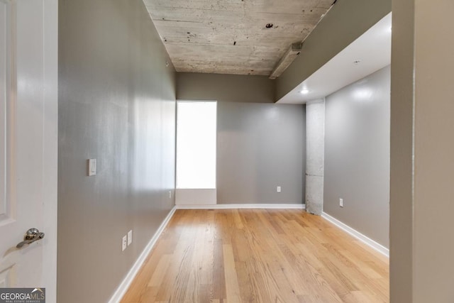 empty room with light hardwood / wood-style flooring