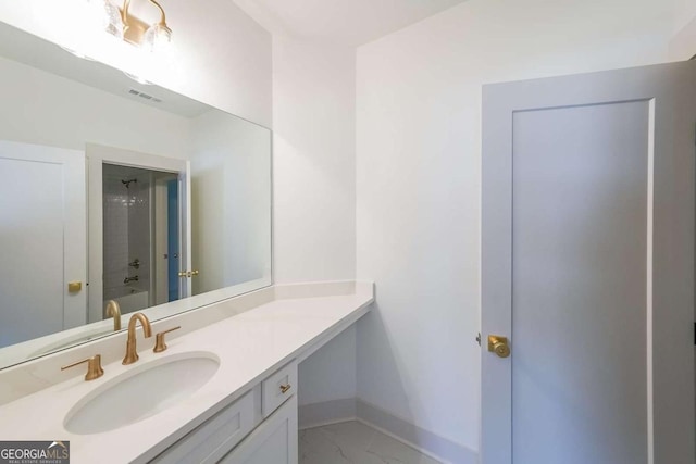 bathroom with vanity and  shower combination