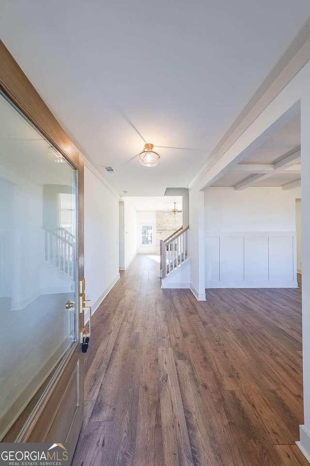 hall featuring hardwood / wood-style flooring and a healthy amount of sunlight