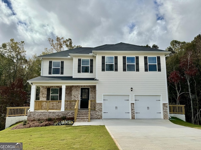 view of front facade featuring a front lawn, a porch, and a garage