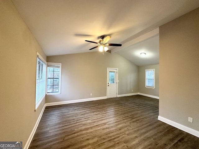 unfurnished room featuring dark hardwood / wood-style floors, lofted ceiling with beams, and ceiling fan