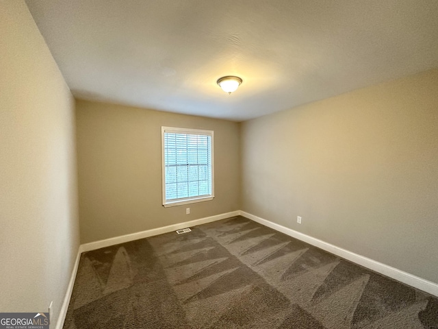 spare room with carpet flooring