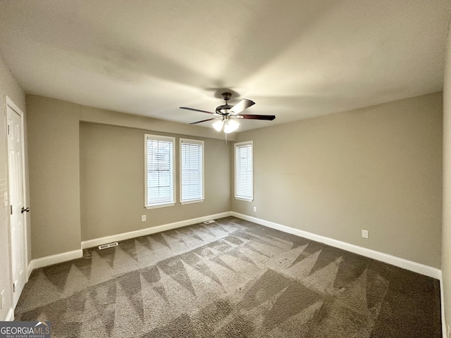 unfurnished room with carpet flooring and ceiling fan