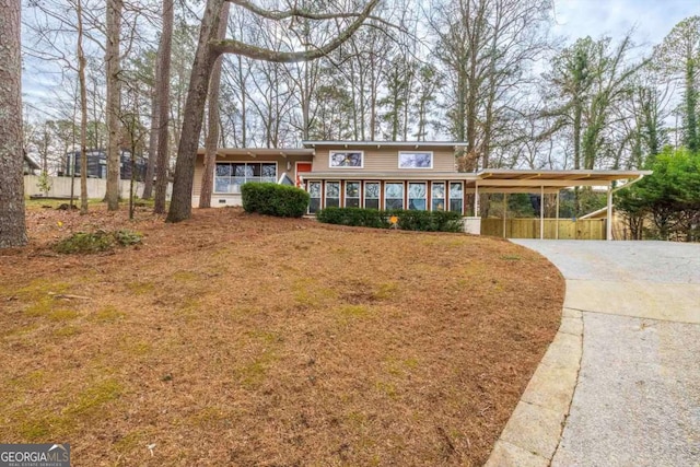 view of front of home with a carport